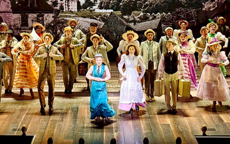 A chorus of performers led by Imelda Staunton in the London production of Hello Dolly, wearing period costumes, mid-song.